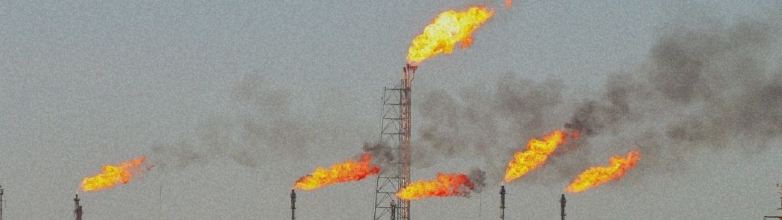 flares burning from stacks at a methane gas facility