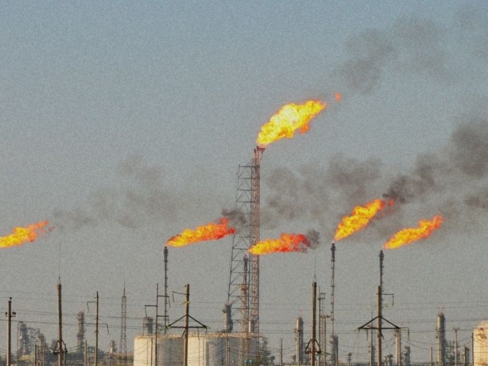 flares burning from stacks at a methane gas facility
